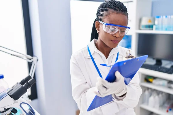 African American Woman Scientist Writing Report Working Laboratory — ストック写真