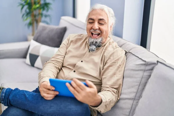 Middle Age Grey Haired Man Watching Video Touchpad Sitting Sofa — Foto Stock