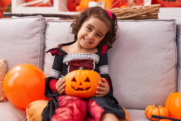 Adorable Hispanic Girl Wearing Halloween Costume Holding Pumpkin Basket Home — Foto de Stock