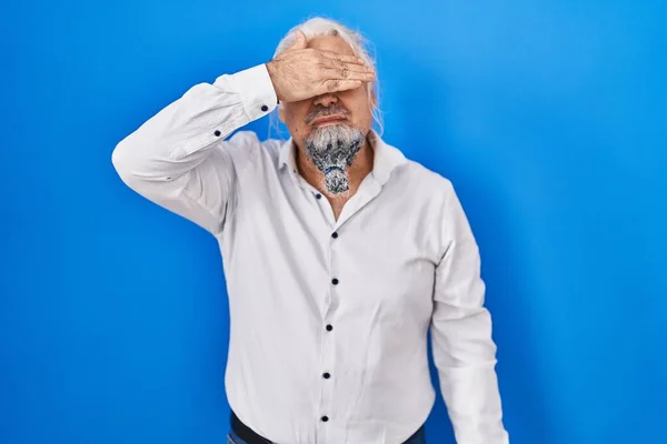 Middle Age Man Grey Hair Standing Blue Background Covering Eyes — Stock Photo, Image