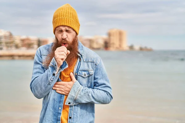 Young Redhead Man Coughing Seaside — Stockfoto