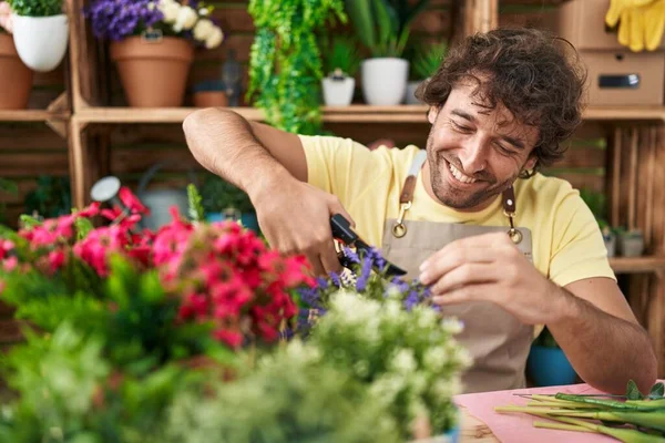 Young Hispanic Man Florist Smiling Confident Cutting Plant Flower Shop — Stock Photo, Image