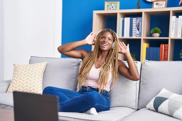 African American Woman Dancing Listening Music Sitting Sofa Home — Φωτογραφία Αρχείου