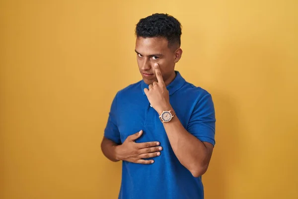 Young Hispanic Man Standing Yellow Background Pointing Eye Watching You — Stock Photo, Image