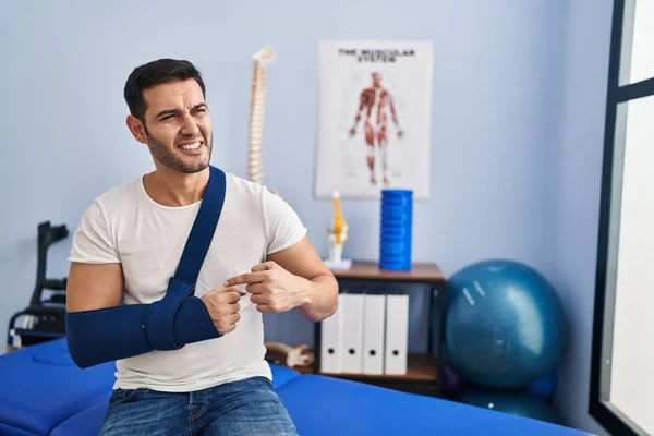 Young Hispanic Man Injured Physiotherapy Patient Suffering Arm Pain Rehab — Stock Fotó