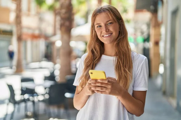 Young Blonde Girl Smiling Confident Using Smartphone Street — Fotografia de Stock