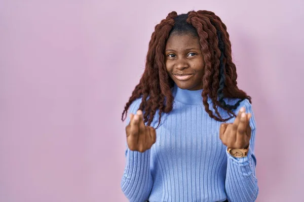 African Woman Standing Pink Background Doing Money Gesture Hands Asking — Stock Photo, Image
