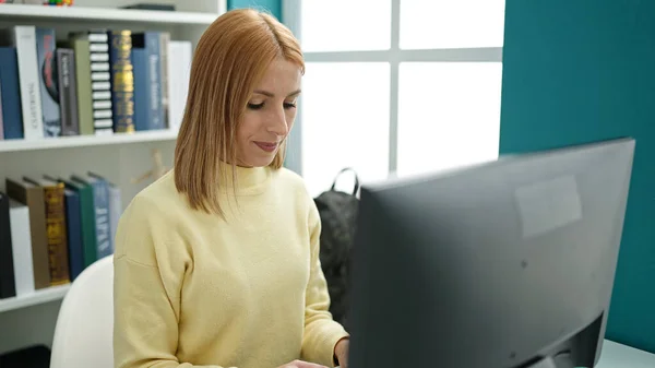 Young Blonde Woman Student Using Computer Studying University Classroom — Fotografia de Stock