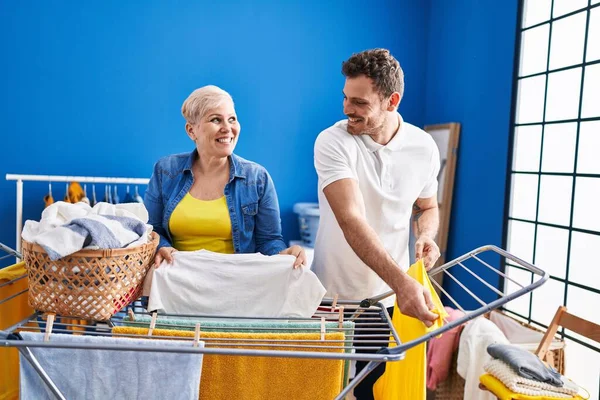 Mother Son Smiling Confident Hanging Clothes Clothesline Laundry Room — Stock fotografie
