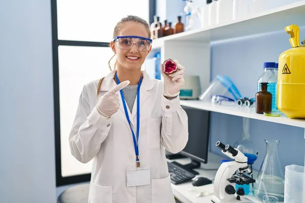 Young Woman Working Scientist Laboratory Holding Geode Smiling Happy Pointing — Stock Photo, Image