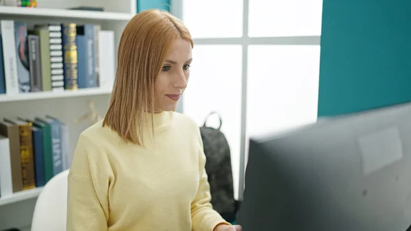 Young Blonde Woman Student Using Computer Studying University Classroom —  Fotos de Stock
