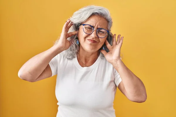 Middle Age Woman Grey Hair Standing Yellow Background Covering Ears — Stock Photo, Image