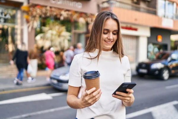 Young Blonde Woman Using Smartphone Drinking Coffee Street — Stockfoto