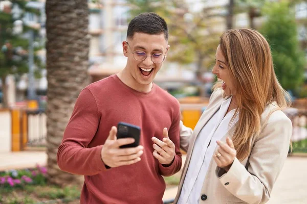 Man Woman Mother Son Smiling Confident Using Smartphone Park — Stok fotoğraf