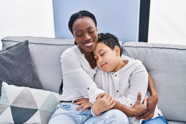 African American Mother Son Hugging Each Other Sitting Sofa Home — Stockfoto