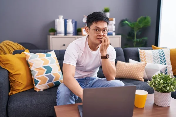 Young Asian Man Using Laptop Home Sitting Sofa Looking Stressed — Stock Photo, Image