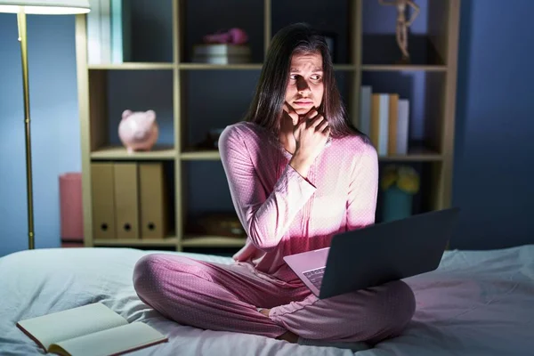 Young Hispanic Woman Using Computer Laptop Bed Looking Stressed Nervous — Stock Photo, Image
