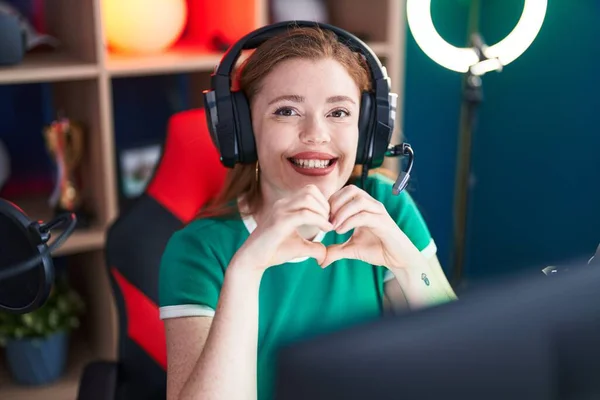 Young Redhead Woman Streamer Smiling Confident Doing Heart Symbol Hands — Stock Photo, Image