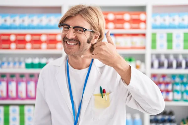 Caucasian Man Mustache Working Pharmacy Drugstore Smiling Doing Phone Gesture — Stock Photo, Image