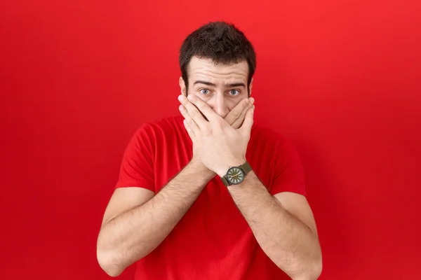 Young Hispanic Man Wearing Casual Red Shirt Shocked Covering Mouth — Stock Photo, Image