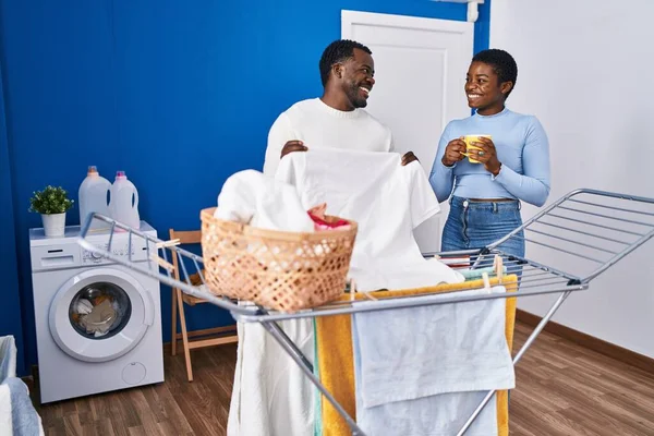 Man Woman Couple Drinking Coffee Hanging Clothes Clothesline Laundry Room — Stock Photo, Image
