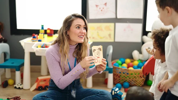 stock image Woman and boys having vocabulary lesson with word cards at kindergarten