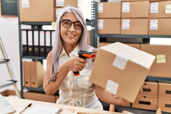 Middle Age Grey Haired Woman Business Ecommerce Worker Scanning Package — Stock Photo, Image