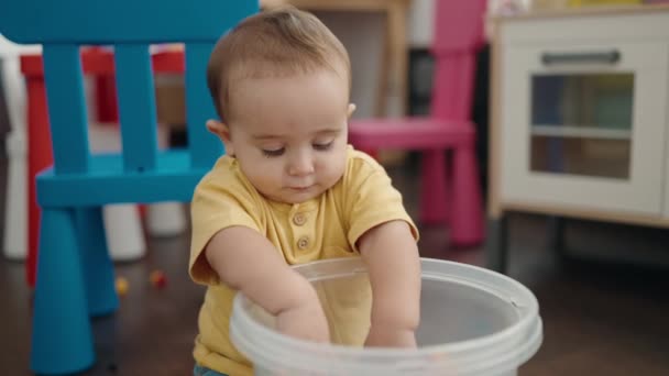 Adorable Hispanic Baby Playing Construction Blocks Sitting Floor Kindergarten — Vídeo de Stock