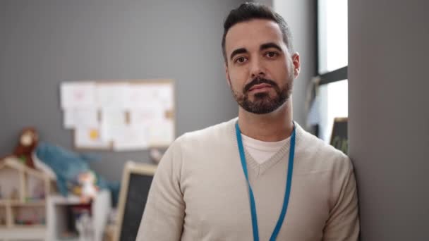 Young Hispanic Man Teacher Smiling Confident Standing Arms Crossed Gesture — Stock videók