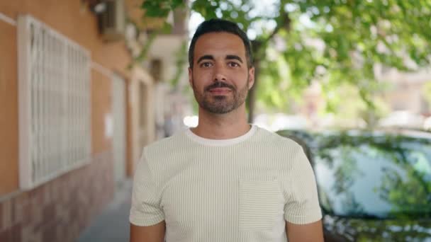 Young Hispanic Man Smiling Confident Doing Photo Gesture Hands Street — Vídeos de Stock