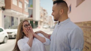 Man and woman mother and daugther hugging each other at street
