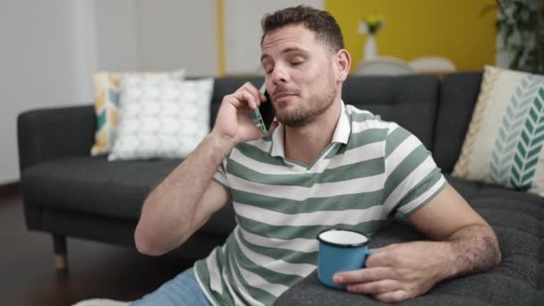 Young Caucasian Man Speaking Phone Sitting Sofa Home — Video Stock