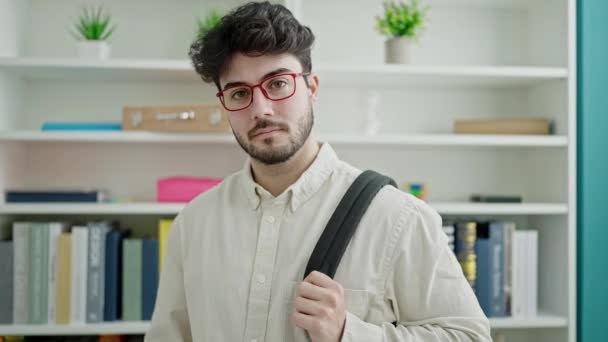 Young Hispanic Man Student Smiling Confident Standing Library University — Αρχείο Βίντεο