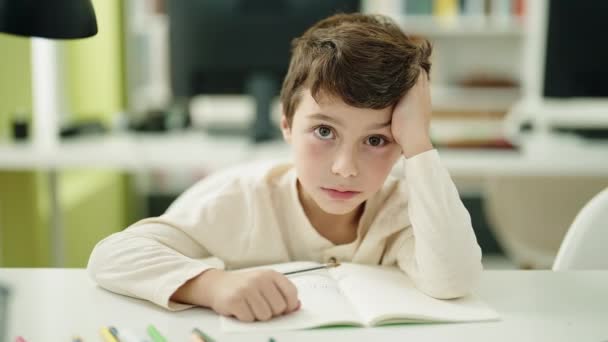 Adorable Hispanic Boy Student Reading Book Classroom — Vídeos de Stock
