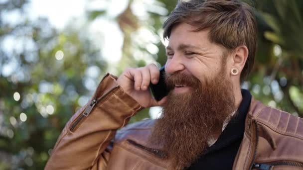 Young Redhead Man Smiling Confident Talking Smartphone Park — Stockvideo