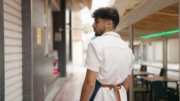 Young Arab Man Waiter Standing Arms Crossed Gesture Restaurant — Αρχείο Βίντεο