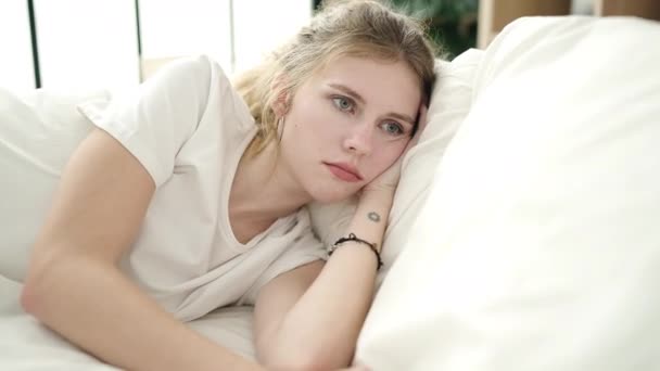 Young Blonde Woman Lying Bed Sad Expression Bedroom — Stockvideo