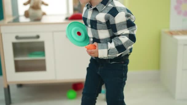 Adorable Hispanic Boy Playing Play Kitchen Standing Kindergarten — Stockvideo