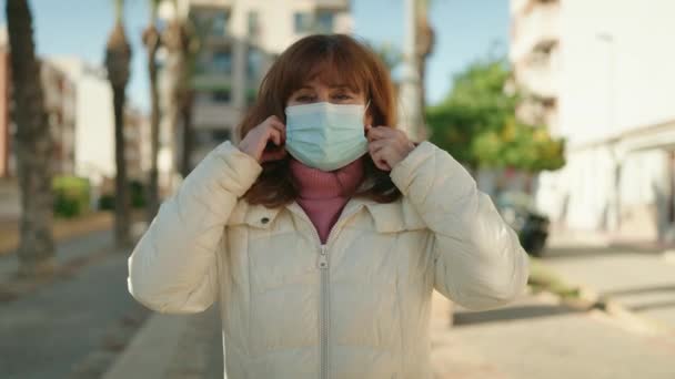 Middle Age Redhead Woman Smiling Confident Wearing Medical Mask Street — ストック動画