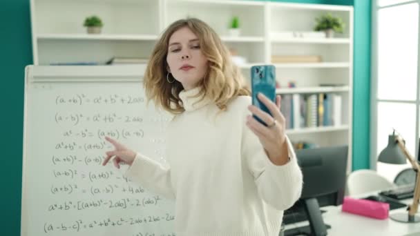 Young Blonde Woman Teacher Having Video Call Explaining Maths Exercise — Stockvideo