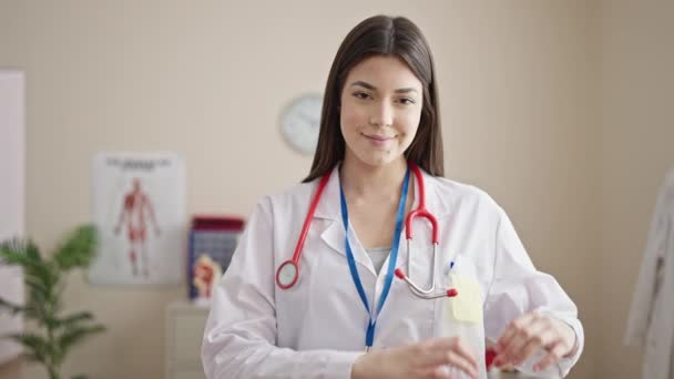 Young Beautiful Hispanic Woman Doctor Doing Heart Gesture Hands Clinic — Video