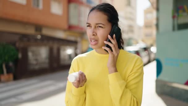 Young African American Woman Talking Smartphone Holding Pills Street — Stok Video