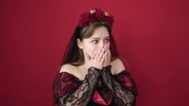 Young blonde woman wearing katrina costume with fear expression over isolated red background