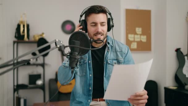 Young Hispanic Man Singing Song Music Studio — Vídeos de Stock