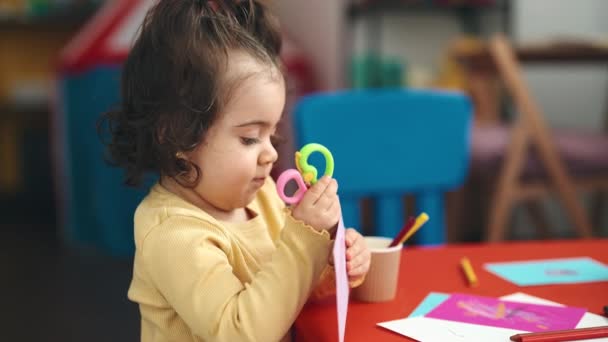 Adorable Hispanic Girl Student Cutting Paper Kindergarten — Stockvideo