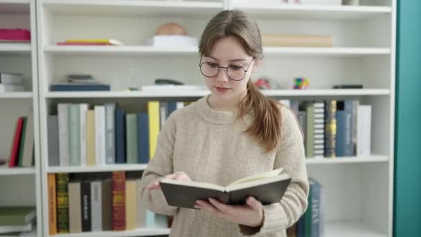 Young Blonde Woman Student Reading Book Doing Silence Gesture Library — Video
