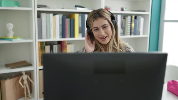 Young Blonde Woman Student Smiling Confident Having Video Call Library — Vídeo de Stock