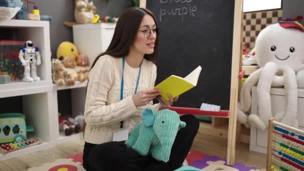Young Beautiful Hispanic Woman Preschool Teacher Reading Story Book Sitting — Stok video