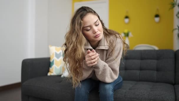 Young Beautiful Hispanic Woman Sitting Sofa Serious Expression Home — Stock video
