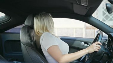 Young beautiful hispanic woman smiling confident wearing car belt at street